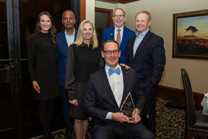 Dr. Herman surrounded by Carilion, VTSOM and CMN representatives